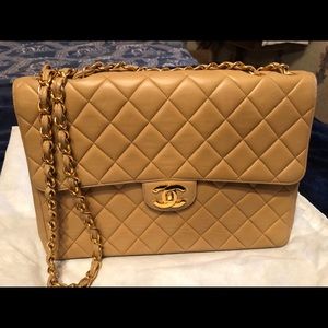 Chanel beige lamb skin leather gold hardware .